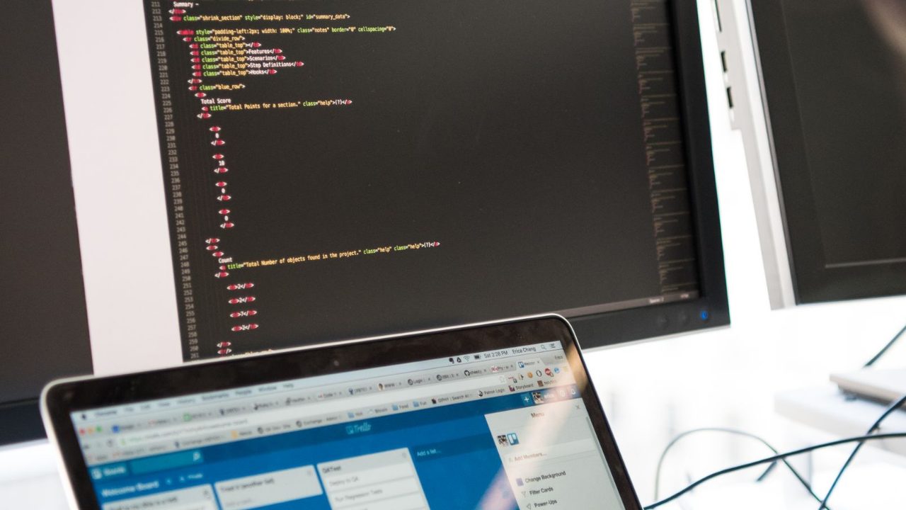 Programmer checking site performance on screens