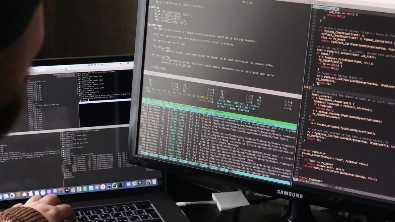 Developer reviewing crawl and indexing on dual monitors