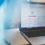 Small business reviewing SEO analytics on a laptop in a modern workspace